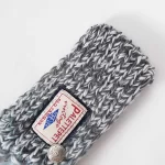 Keep your pet stylish and warm with the Grey-Toned Handcrafted Knitted Pet Scarf. Featuring a timeless grey blend with a soft, luxurious texture, this scarf is perfect for cold weather outings or cozy indoor moments. Its handcrafted design is completed with playful tassels and a vintage-style logo patch, adding both charm and sophistication. Made with high-quality yarn, this scarf offers lightweight warmth without compromising on comfort. Whether paired with a coat or worn alone, it’s the perfect accessory for pets who love understated elegance and functionality.