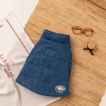 Simplicity meets style with the Minimalist Denim Pet Jacket. This sleek, quilted design offers a timeless denim look with a charming embroidered patch detail, adding a playful touch. Lightweight yet warm, it’s perfect for keeping your pet comfortable during autumn outings or chilly winter strolls. The high-quality stitching ensures durability, while its easy-to-wear design makes it a practical choice for pets of all sizes. Pair it with a matching accessory for a complete, polished look that’s perfect for everyday wear or special occasions.