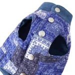 The Paisley Patchwork Denim Pet Jacket is a stylish fusion of classic and contemporary design. Featuring a vibrant blue paisley print and durable denim details, this jacket ensures your pet stays warm and comfortable during cool autumn days and chilly winter nights. The snap-button closure allows for easy wear and a secure fit, while the intricate stitching highlights its high-quality craftsmanship. Perfect for casual outings, park visits, or cozy photoshoots, this jacket is both functional and fashionable. Pair it with a matching leash or bandana to complete the look.